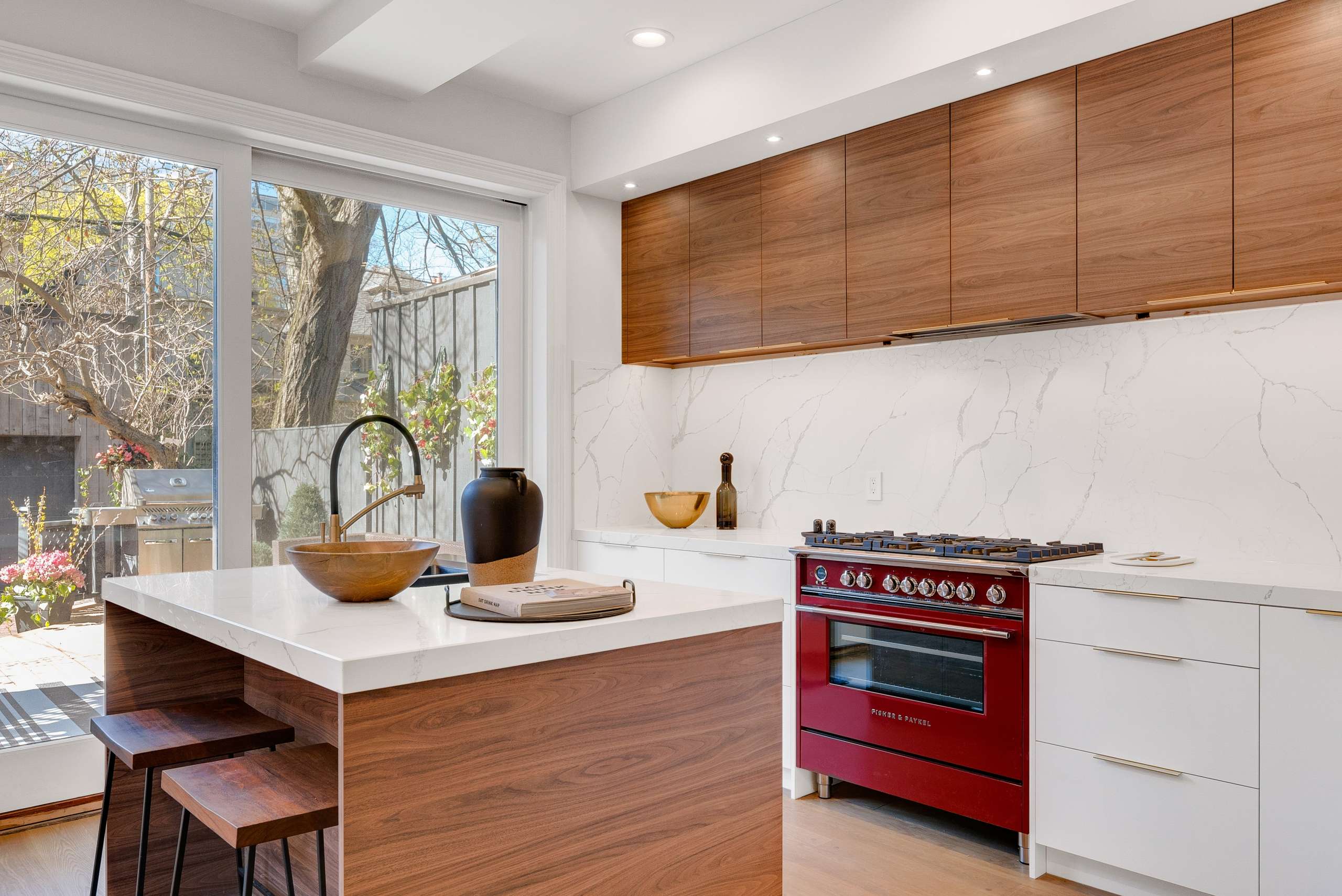 A stunning and vibrant kitchen, featuring newly installed pot lights and a variety of modern appliances. Oceanside Electrical Services specializes in high-quality installations that bring your space to life, adding both style and functionality to your home or business.