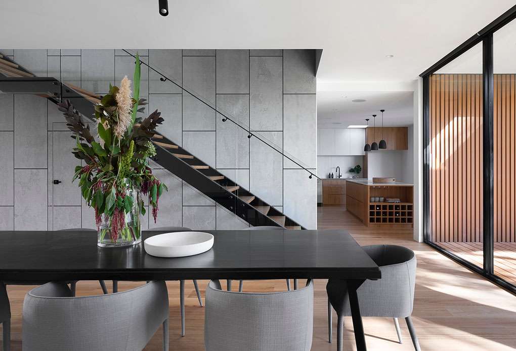 sleek and modern home living room, naturally lit up and has beautiful pot lights recessed in the ceiling